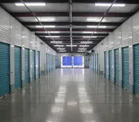 a long hallway with blue doors