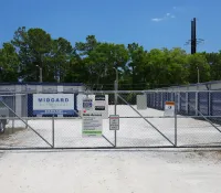 a fence with signs on it