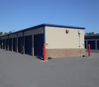 a building with a few red poles