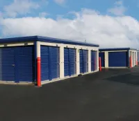 a row of blue and white garage doors