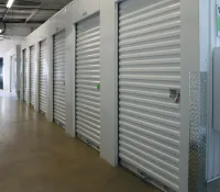 a hallway with white lockers