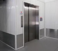 a large elevator with a glass door