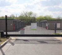 a black gate with a sign on it