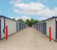 a row of blue and white sheds