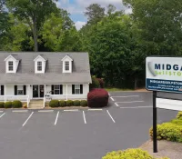 a house with a sign in front of it