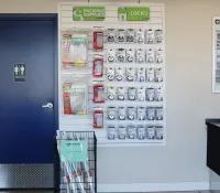 a wall with a sign and a door with a sign on it