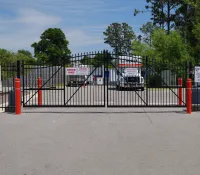 a road with a fence and a truck on it