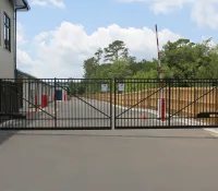 a black fence with a metal gate