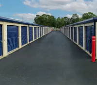 a row of blue and white sheds