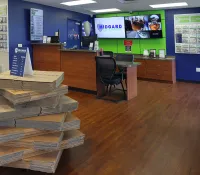 a room with a desk and a chair and a large stack of wood blocks