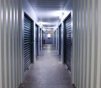 a long hallway with rows of computer servers