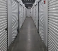 a long hallway with rows of computer servers