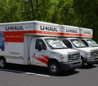 a white truck with a white trailer