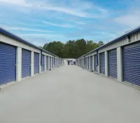 a row of white and blue garages