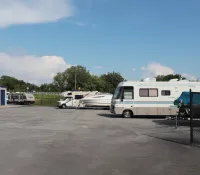 a group of rvs parked in a parking lot