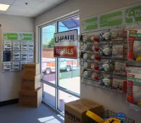 a store front with boxes and signs