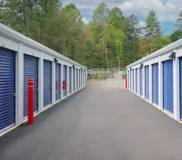 a row of white and blue sheds