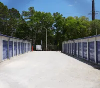 a row of white and blue shipping containers