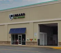 a store front with a blue awning