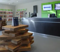 a room with a table and shelves with books on it