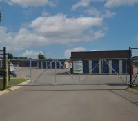 a gated off area with a building in the background