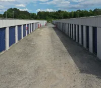 a long row of white and blue metal fences