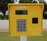 a yellow mailbox on grass