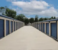 a row of blue and white garage doors