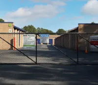 a fenced off area with a sign on it