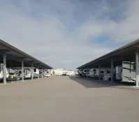 a group of rvs parked in a parking lot