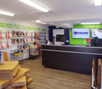 a store with shelves and a sign