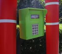 a green and red mailbox