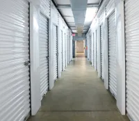 a hallway with white lockers