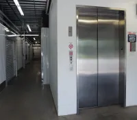 a hallway with metal doors