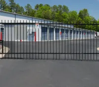 a black gate with a metal fence