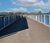 a row of white metal fence