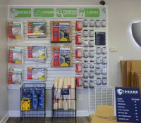 a shelf with boxes and items on it