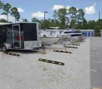 a trailer parked next to a boat