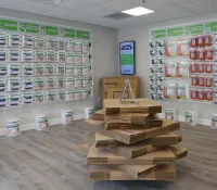 a room with shelves of boxes and boxes