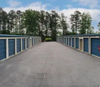 a row of blue and white sheds