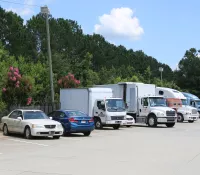 a group of cars parked in a parking lot