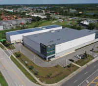 a large building with a parking lot