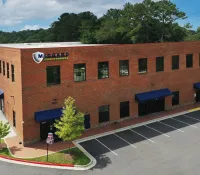 a brick building with a sign on it