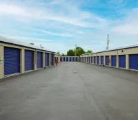 a group of buildings with blue doors