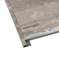Close-up of a marble-patterned tile with an attached L-shaped edge trim in neutral tones.