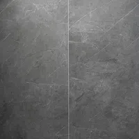 Close-up of dark gray marble tiles with natural white veining and texture, showcasing elegant stone surface.