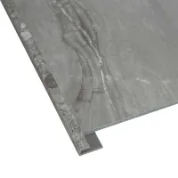 Gray marble-effect tile with L-shaped metal trim for edge protection and stylish finish.