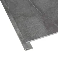 Close-up of a dark gray tile with an L-shaped metal edge trim for protecting corners and edges.
