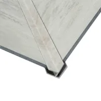 Close-up of concrete corner panels joined with a metal channel bracket on white background