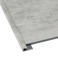 Close-up of a gray tile with a metal edge trim for flooring or wall protection.
